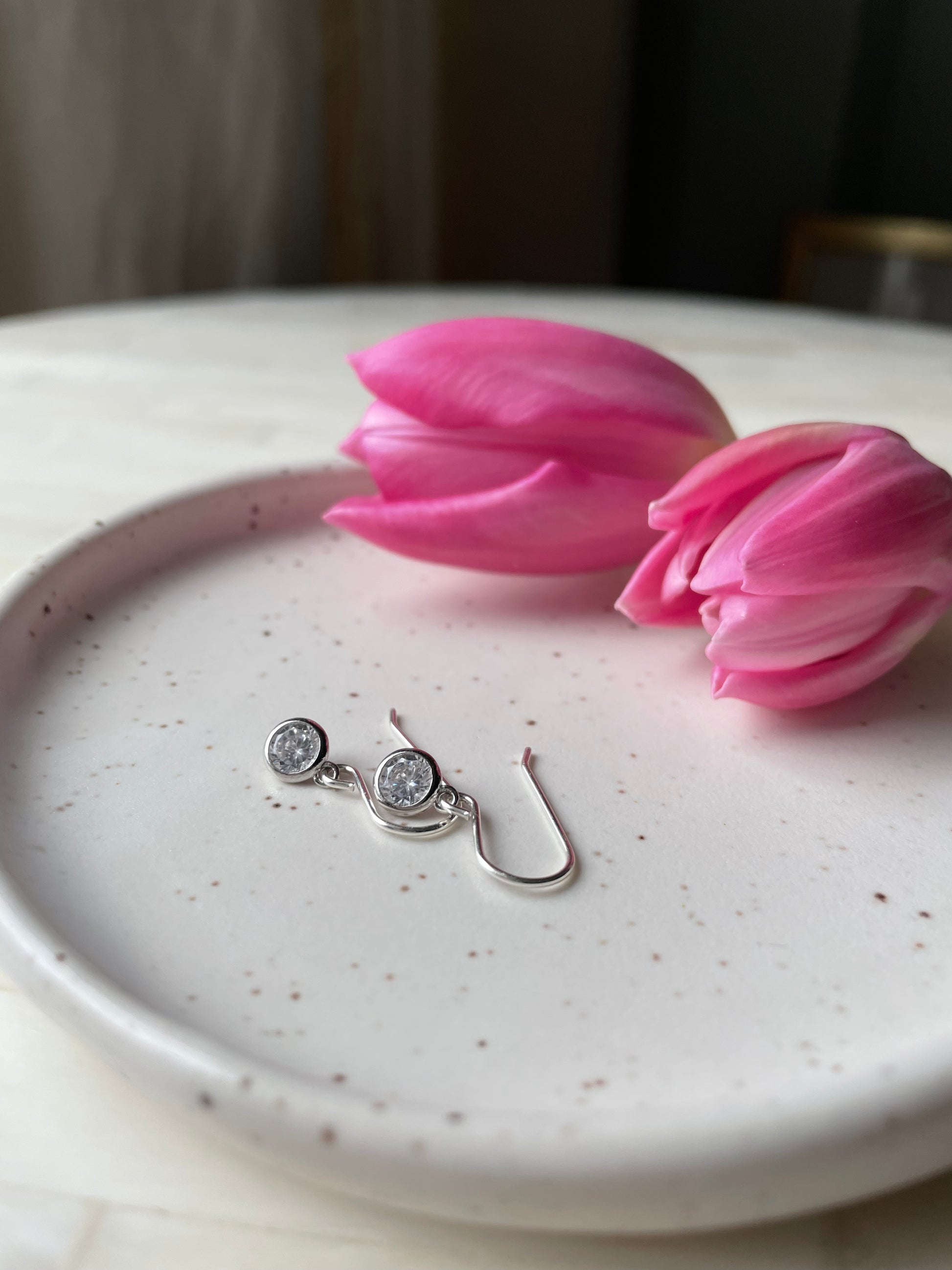 Sterling silver April birthstone earrings. Nancy Wallis Designs in Ontario, Canada.