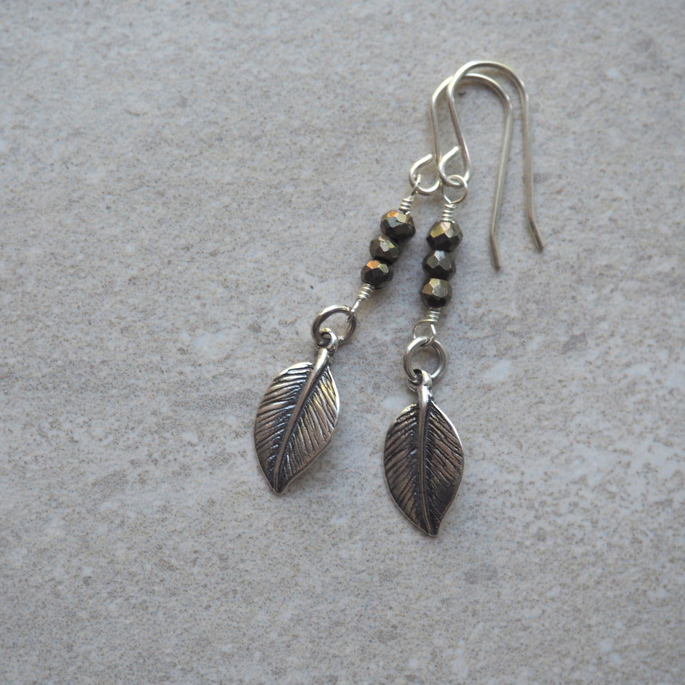 Long sterling silver earrings with silver leaf and gemstones