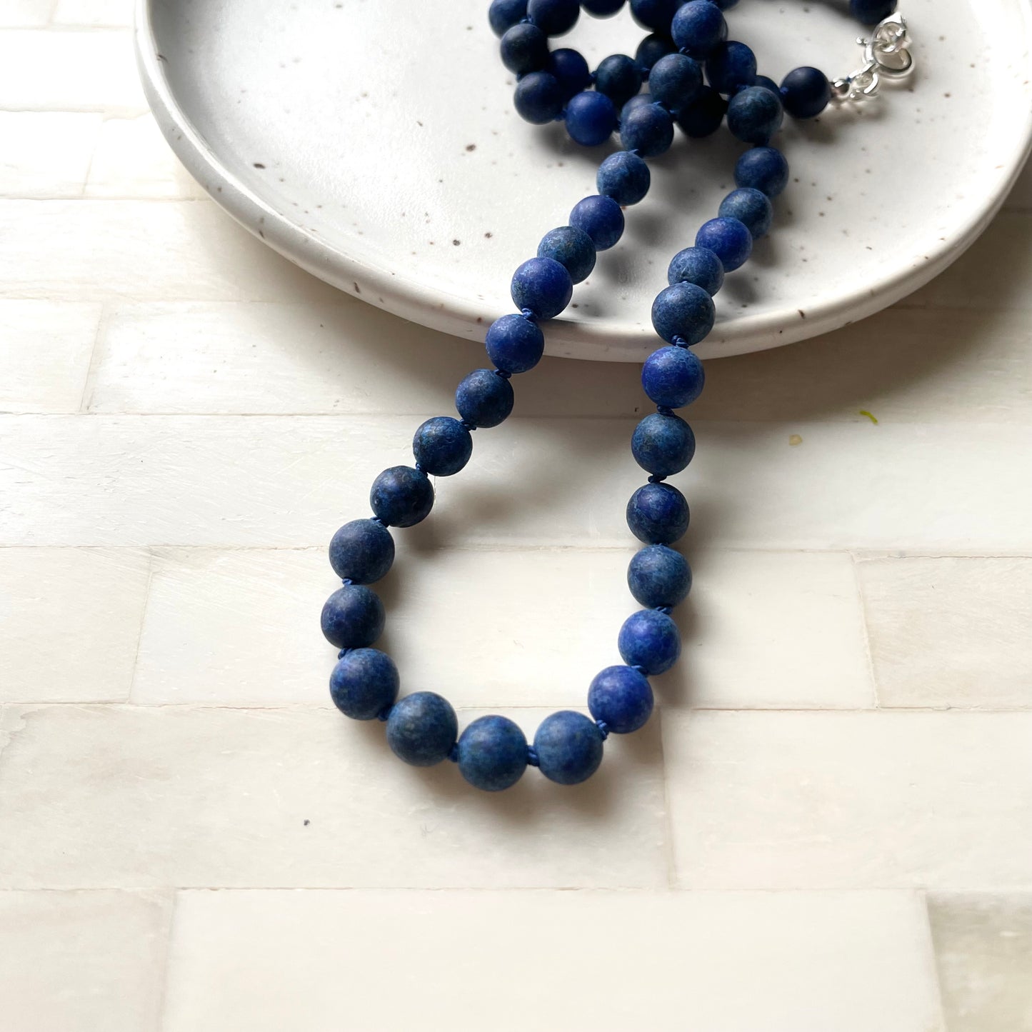 Lapis Lazuli beaded necklace made in Canada by Wallis Designs. Hand knotted stones on silk thread.