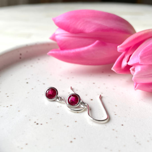 July birthstone earrings. Sterling Silver and cubic zirconia in ruby colour. Made in Canada.