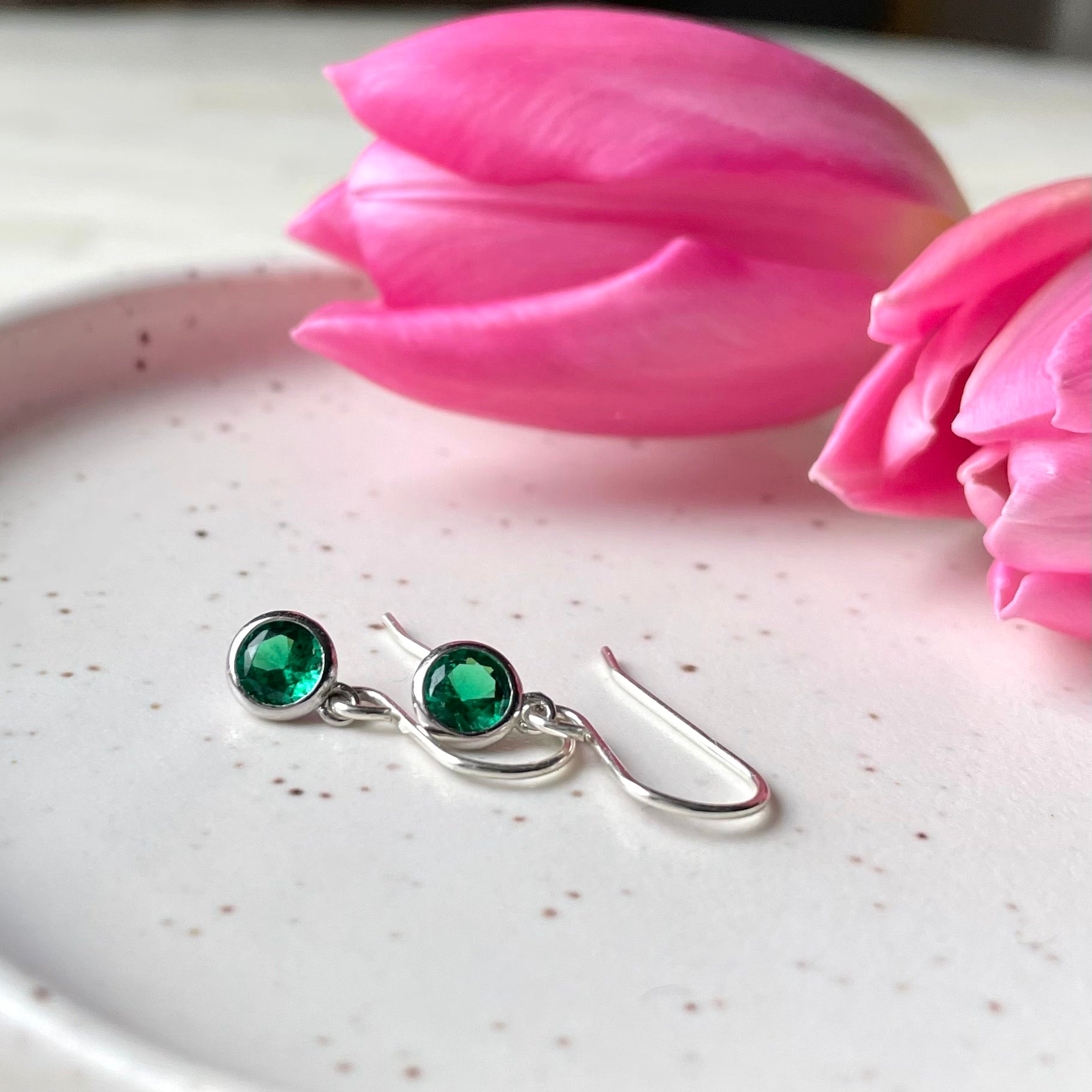 May birthstone earrings. Sterling Silver and Cubic Zirconia in emerald green colour. Made in Canada.