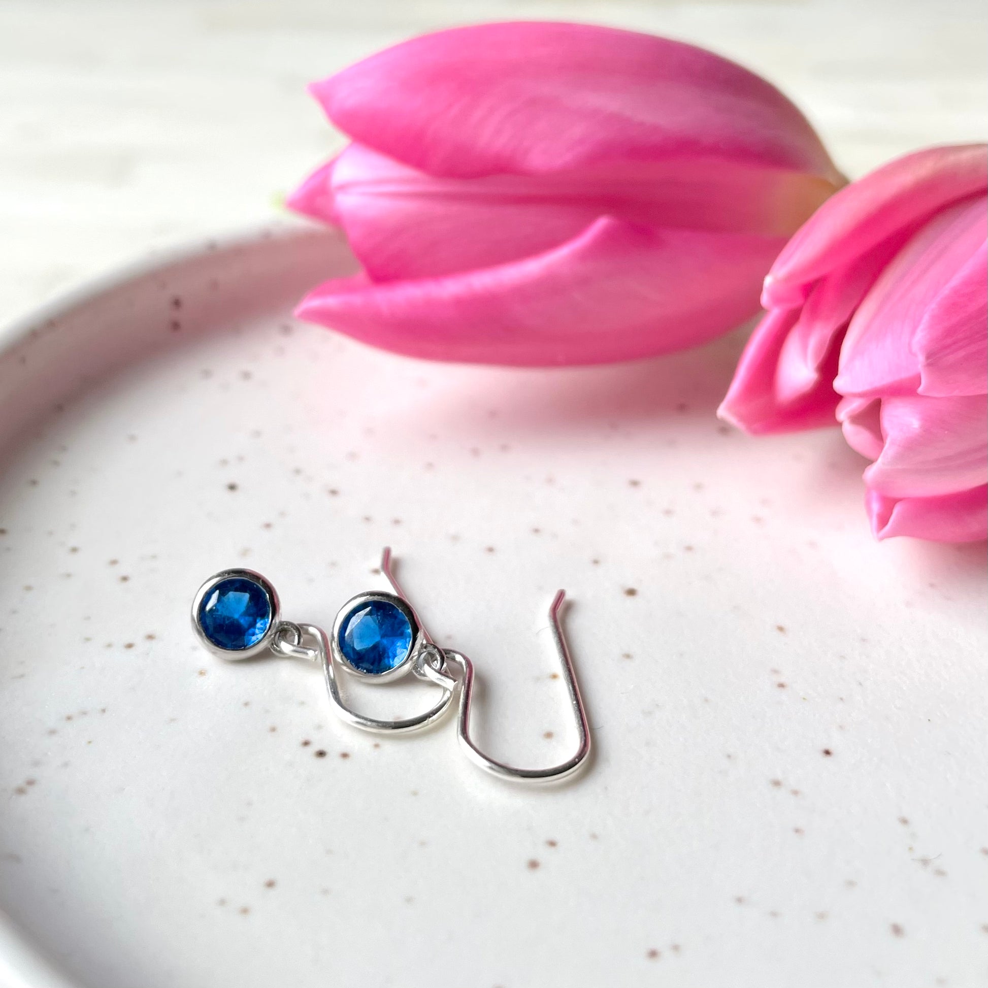 December birthstone earrings. Cubic zirconia blue sapphire and sterling silver. Made in  Canada.