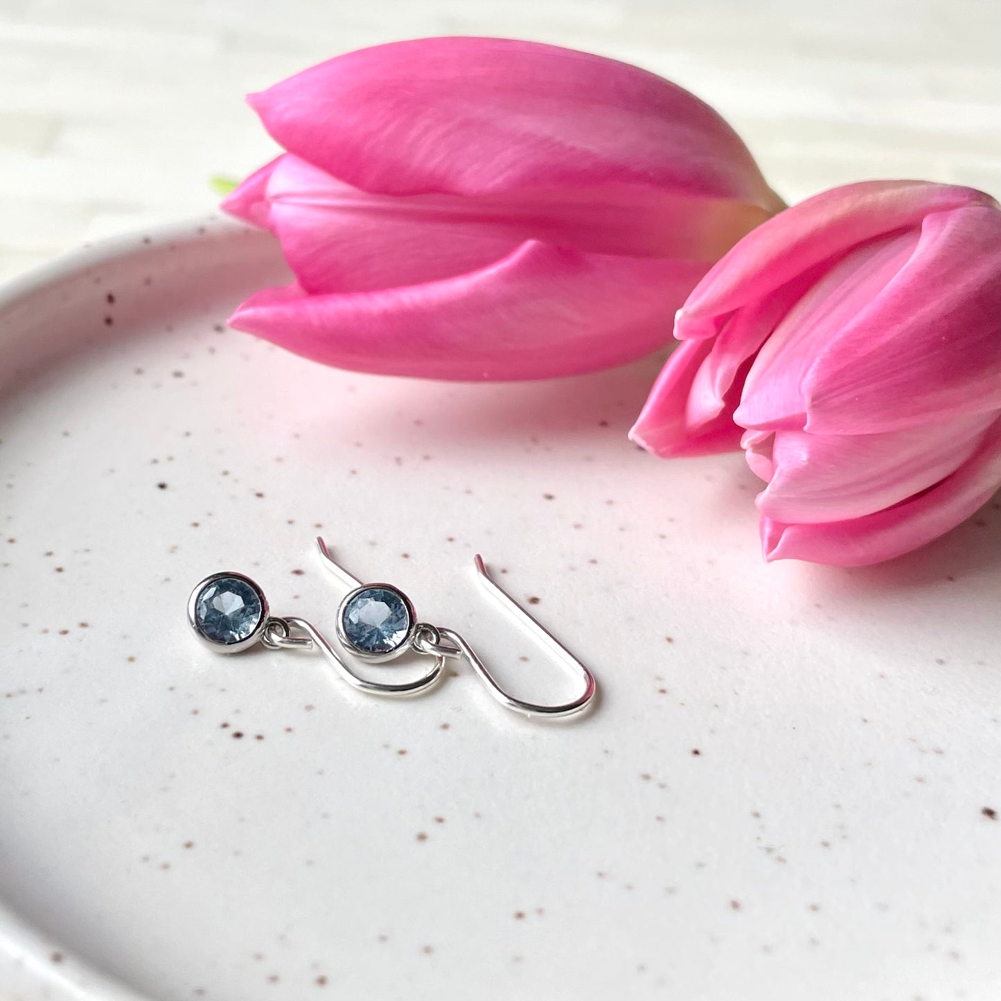 March birthstone earrings. Aquamarine colour. Sterling Silver and cubic zirconia. Made by Wallis Designs in Canada.