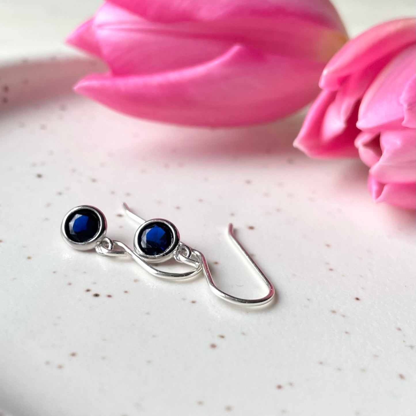 September birthstone earrings. Sterling silver and cubic zirconia in sapphire blue colour. Made in Canada by Wallis Designs.