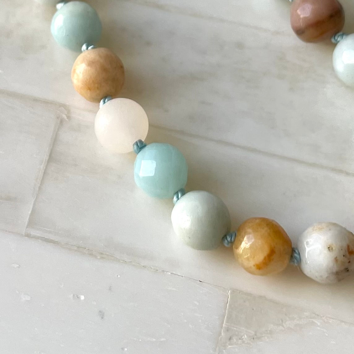 Hand knotted semi precious stone beaded necklace. Made in Canada by Wallis Designs.