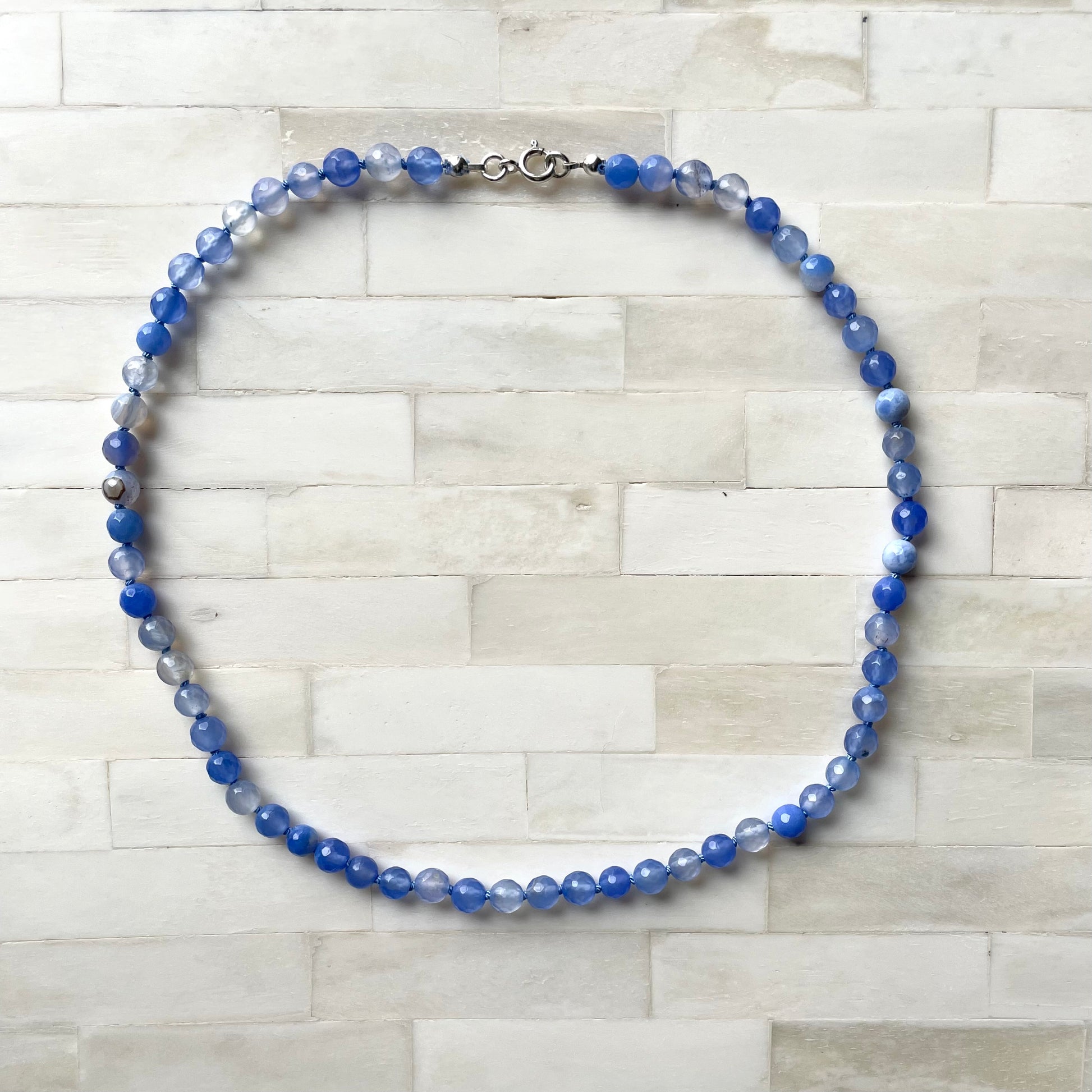 Blue stone necklace by Wallis Designs. Hand knotted on silk thread. Made in Canada.